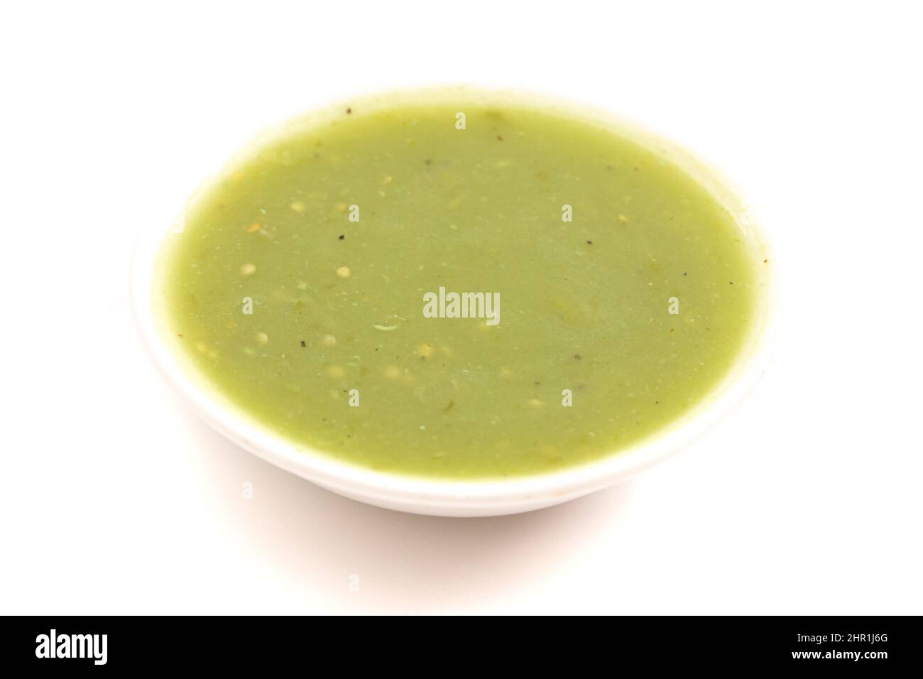 Small Bowl of Green Salsa Verde Isolated on a White Background Stock Photo