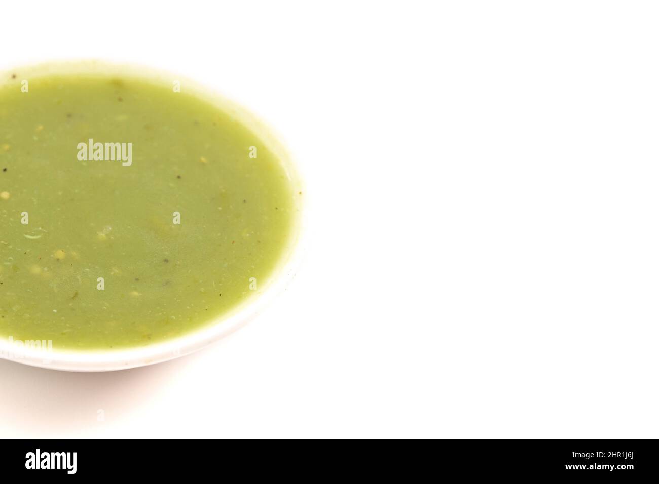 Small Bowl of Green Salsa Verde Isolated on a White Background Stock Photo