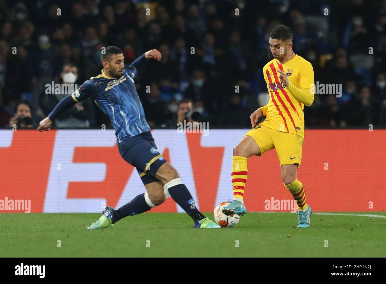 SSC Napoli's Algerian defender Faouzi Ghoulam  challenges for the ball with Barcellona's Usa defender Sergino Dest during the UEFA Europa League football match between SSC Napoli and Barcellona at the Diego Armando Maradona Stadium in Naples, southern Italy, on February 24, 2022. Stock Photo