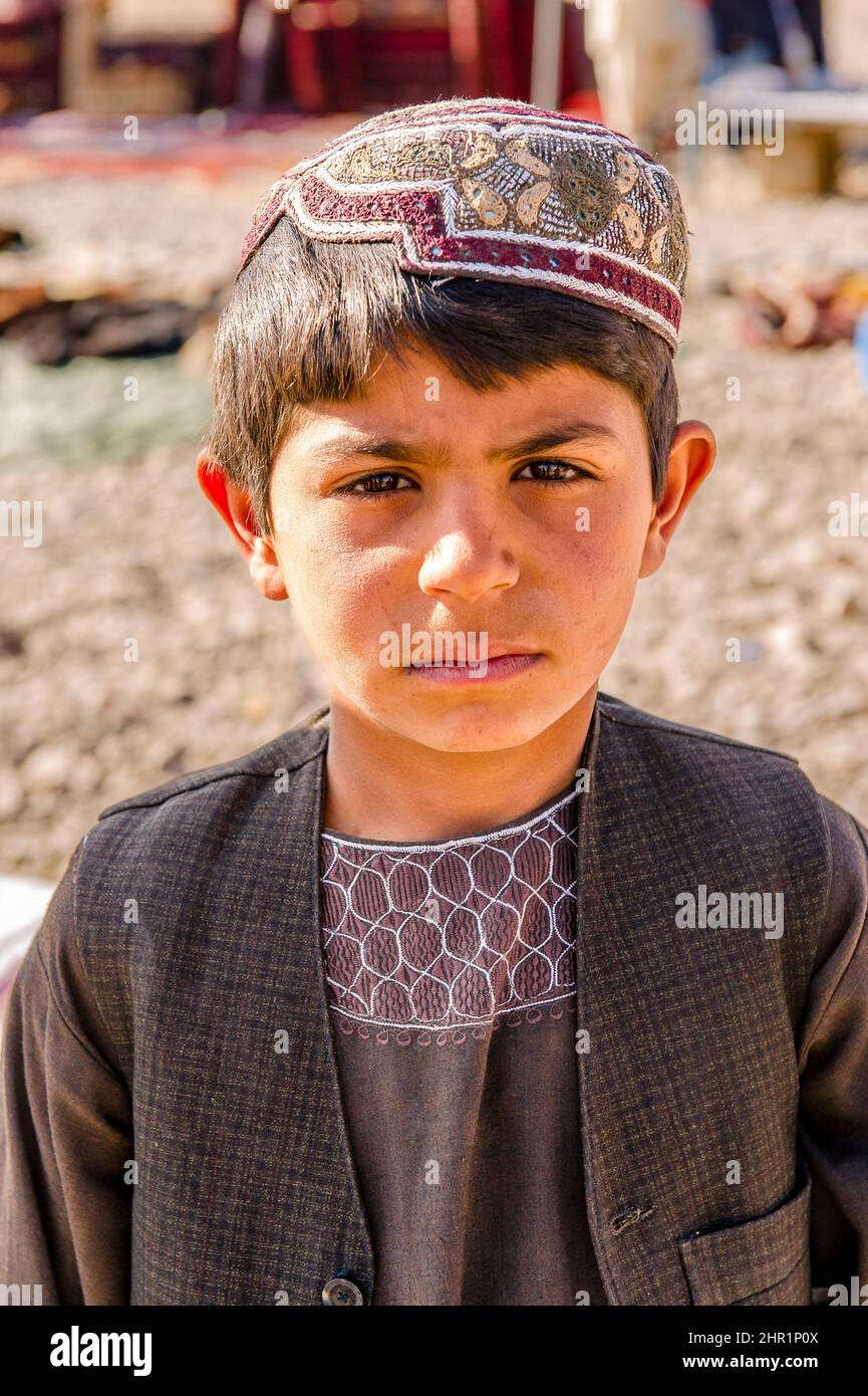 A young boy at an Afghan market in Tarin Kot, Afghanistan Stock Photo