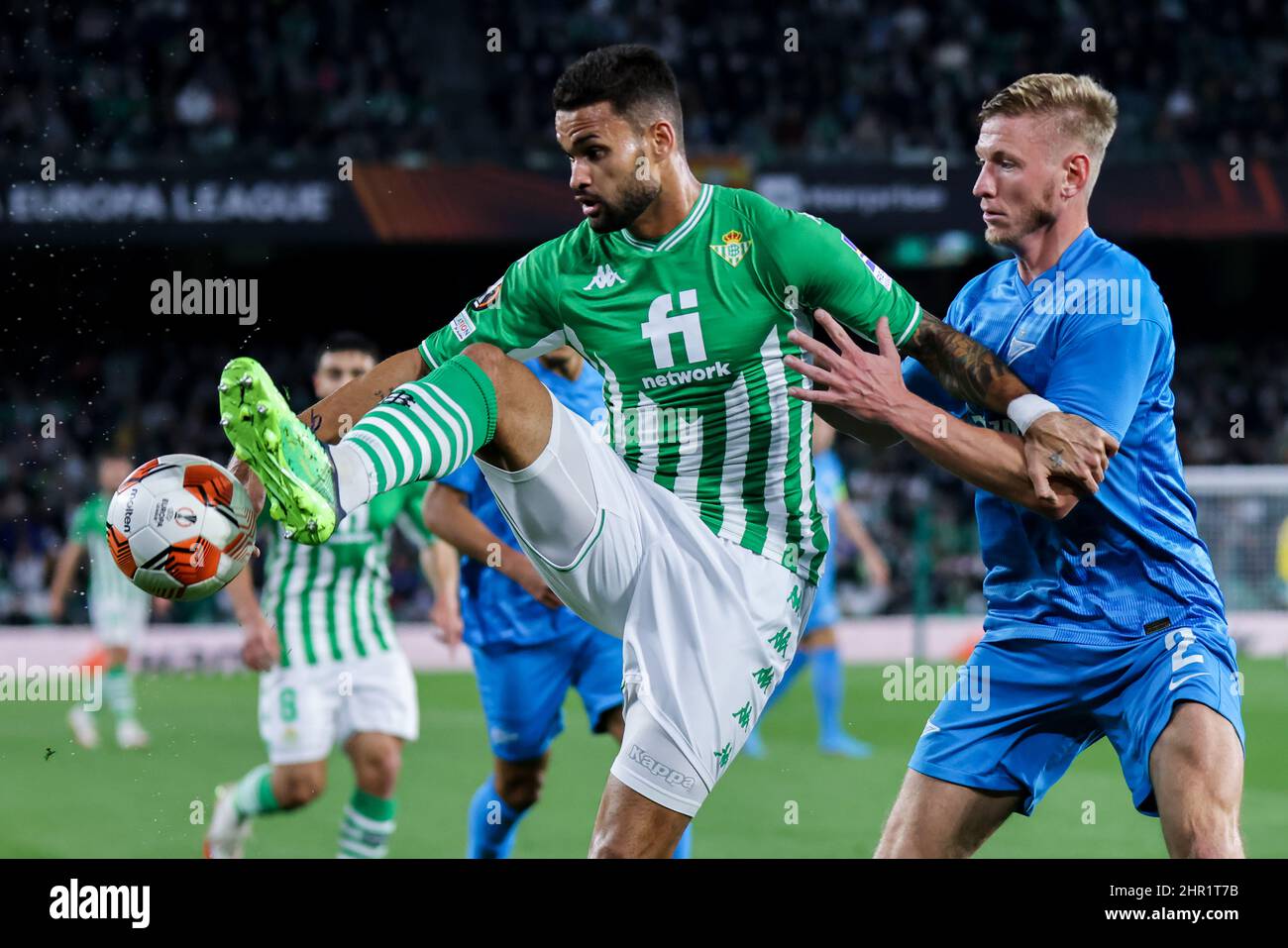 Seville, Seville, Spain. 24th Feb, 2022. William Jose of Real Betis in action with Dmitri Chistyakov of Zenit St. Petersburg during the UEFA Europa League Knockout Round PlayOffs Leg One match between Real Betis and Zenit St. Petersburg at Benito Villamarin Stadium on February 24, 2022 in Seville, Spain. (Credit Image: © Jose Luis Contreras/DAX via ZUMA Press Wire) Stock Photo