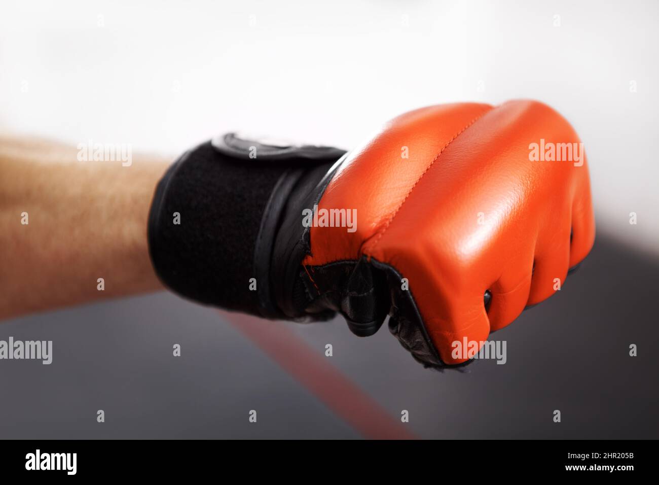 Give it all youve got. Cropped shot of a martial artists fist in a red kickboxing glove. Stock Photo