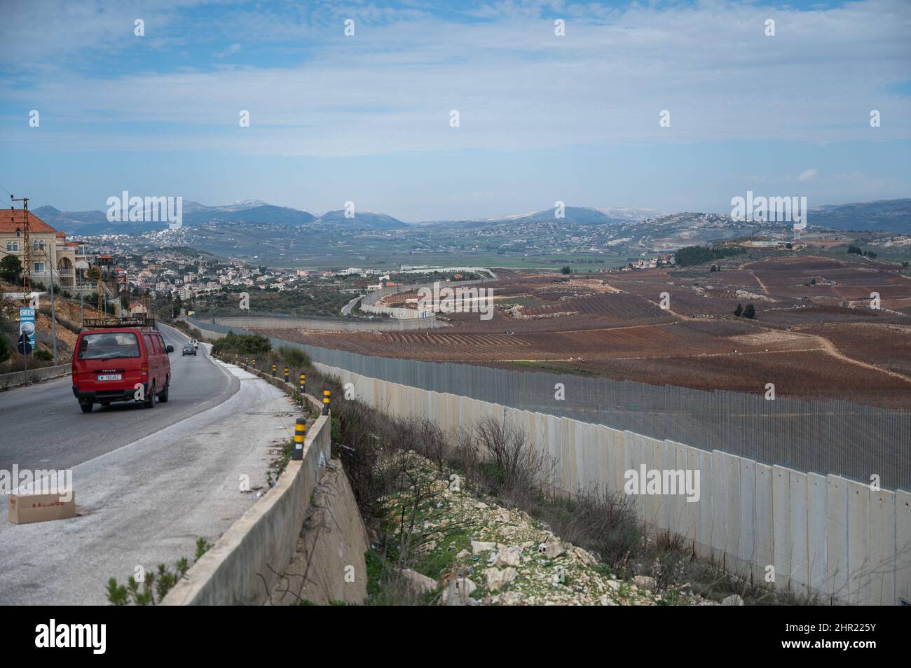 Kafar Kila, Lebanon. 24th Feb, 2022. Cars drive along a country road at ...