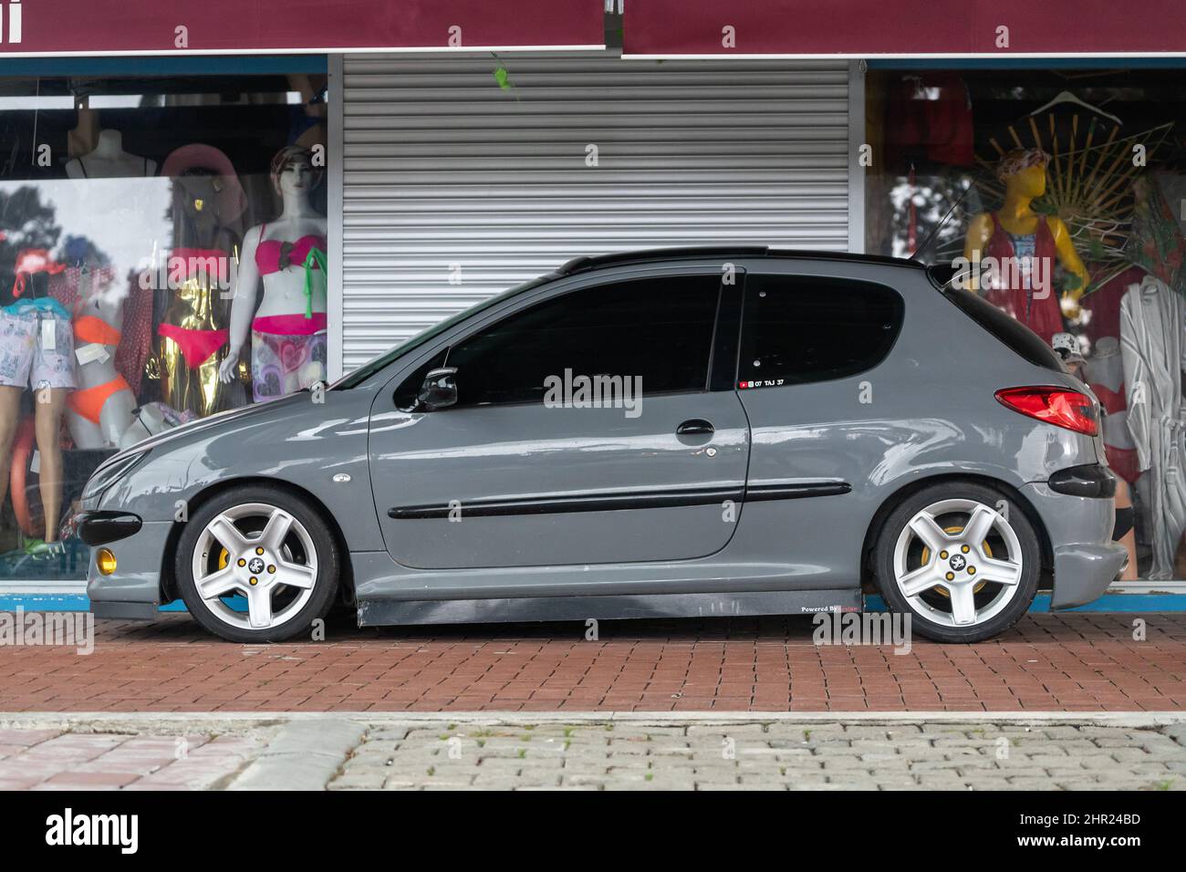 Side, Turkey – February 02 2022:silver Peugeot 207 is parked on the street  on a warm summer day against the trees, fence Stock Photo - Alamy