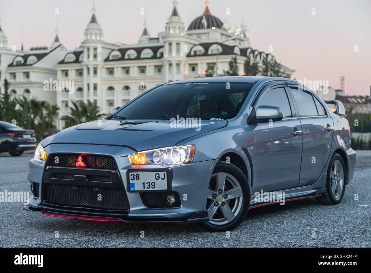 Side, Turkey – February 02 2022:  silver Mitsubishi Lancer    is parked  on the street on a warm  autumn  day against the backdrop of a street, hotel Stock Photo