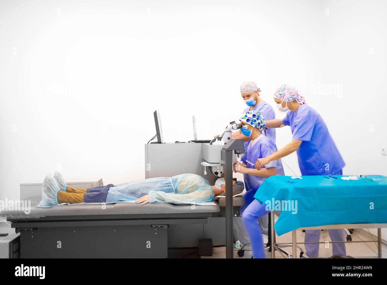 A team of doctors working together to help a patient Stock Photo
