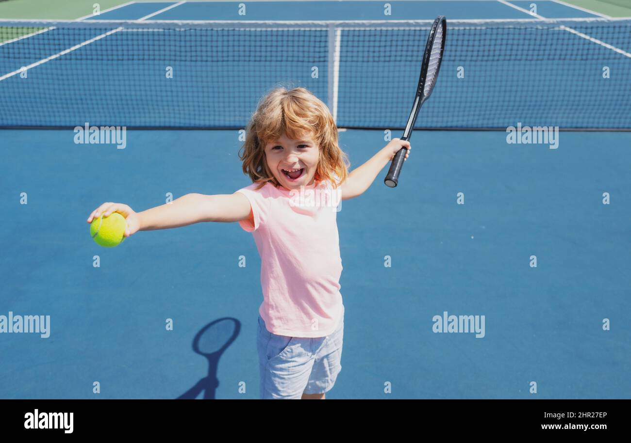Kid tennis player on tennis court. Boy hitting forehand in tennis Stock