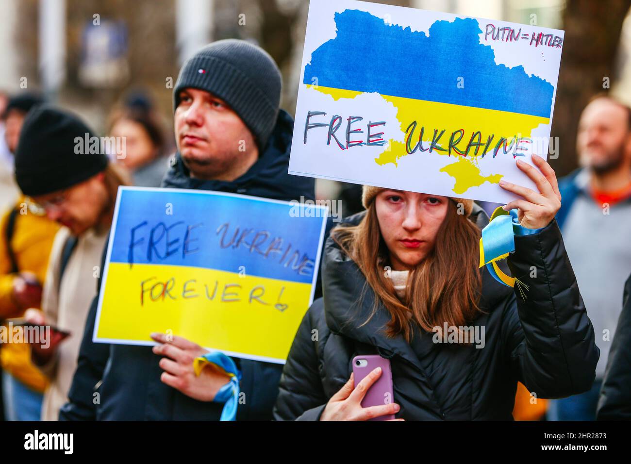 Members of Ukrainian community seen holding a placards that read 'Free Ukraine, Putin equals Hitler'.  Following the beginning of the Russian invasion Stock Photo