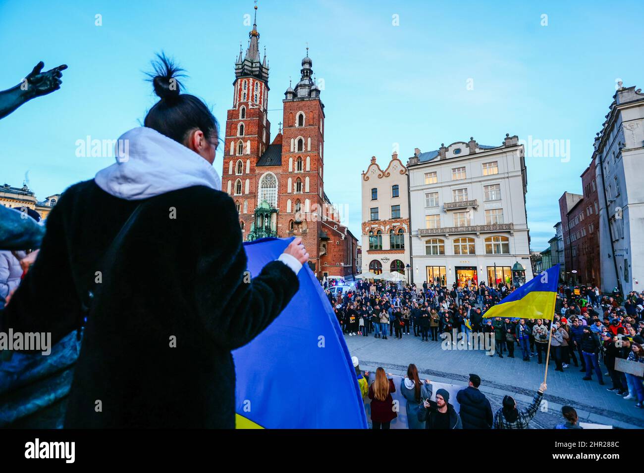A member of Ukrainian community holds a giant natiional Ukrainian flag.  Following the beginning of the Russian invasion of Ukraine, members of the Uk Stock Photo