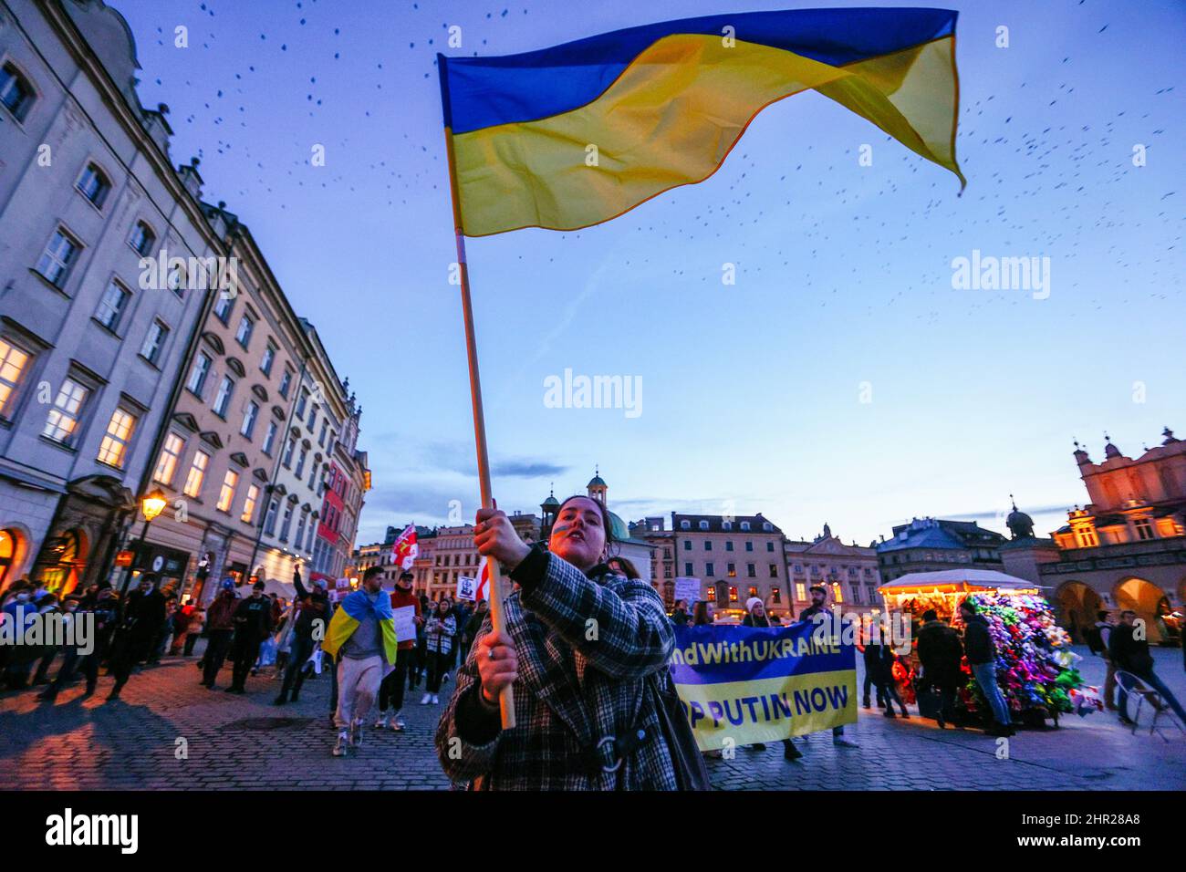 A member of Ukrainian community waves a flag during the protest.  Following the beginning of the Russian invasion of Ukraine, members of the Ukrainian Stock Photo