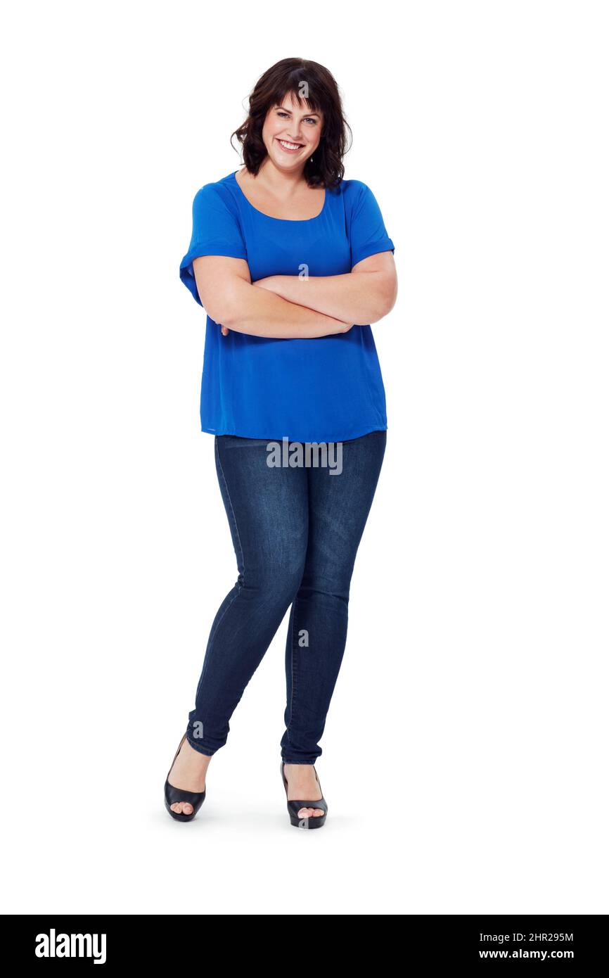 She wears her clothes with attitude. Full length studio shot of a young  woman isolated on white Stock Photo - Alamy