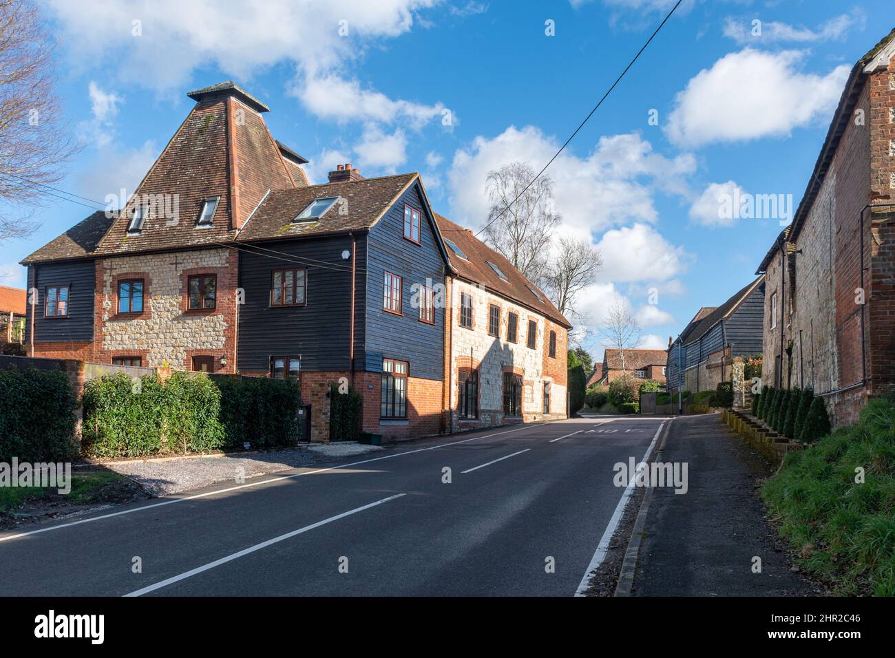 Inwood Kilns, former hop kiln or oast house converted into homes in The Street, Binsted village, Hampshire, England, UK Stock Photo