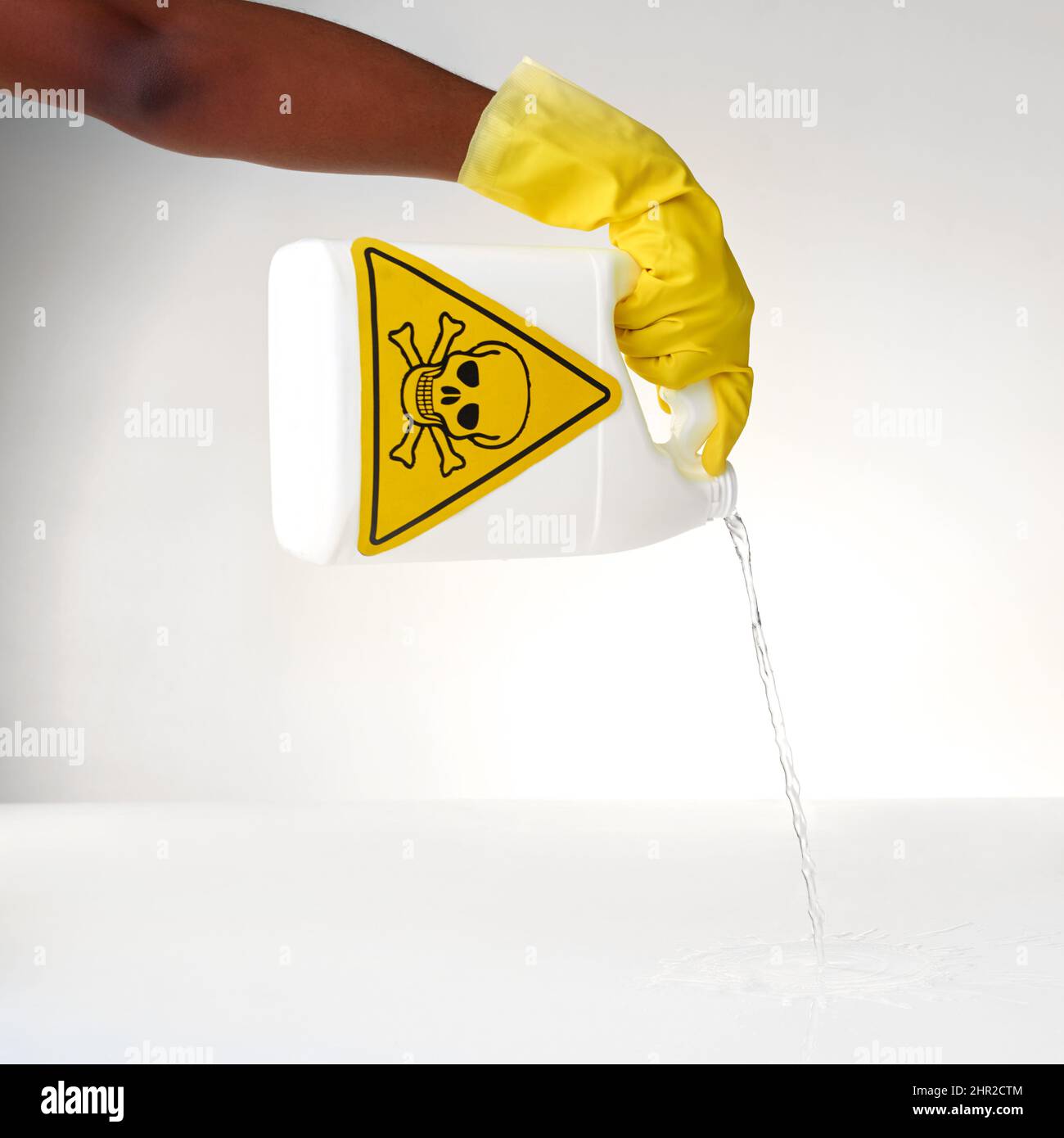 Handling some dangerous detergents. Cropped shot of a person pouring