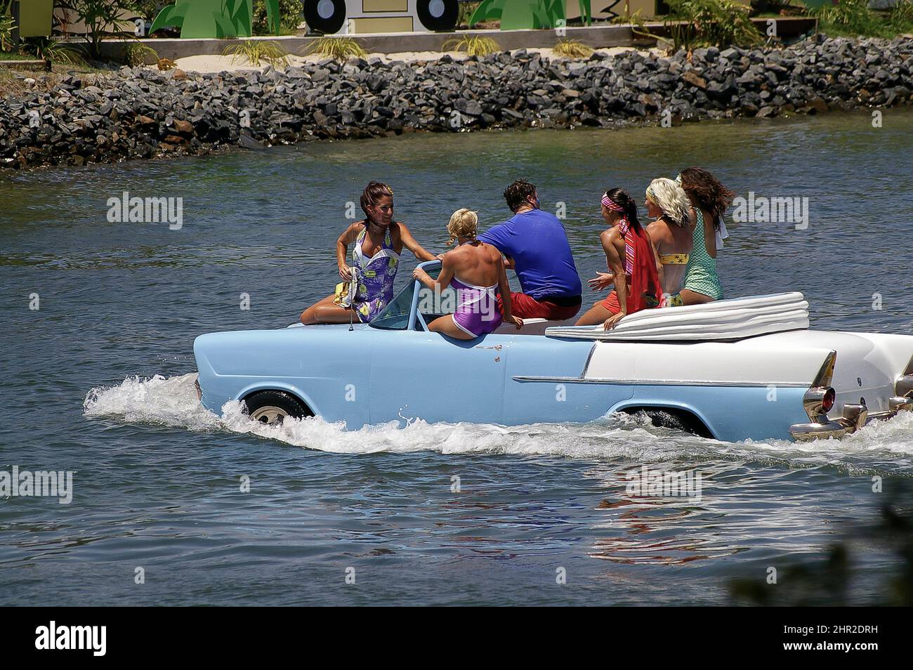 Water-ski Wipeout entertainers driving in floating blue and white car at Sea World theme park on the Gold Coast, Queensland, Australia, summer, 2005. Stock Photo