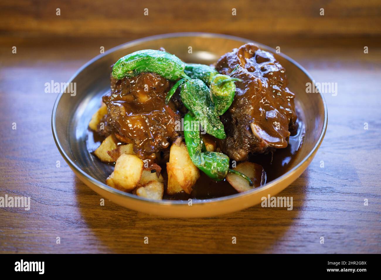 Bull's tail cooked and ready to eat in a Spanish restaurant Stock Photo
