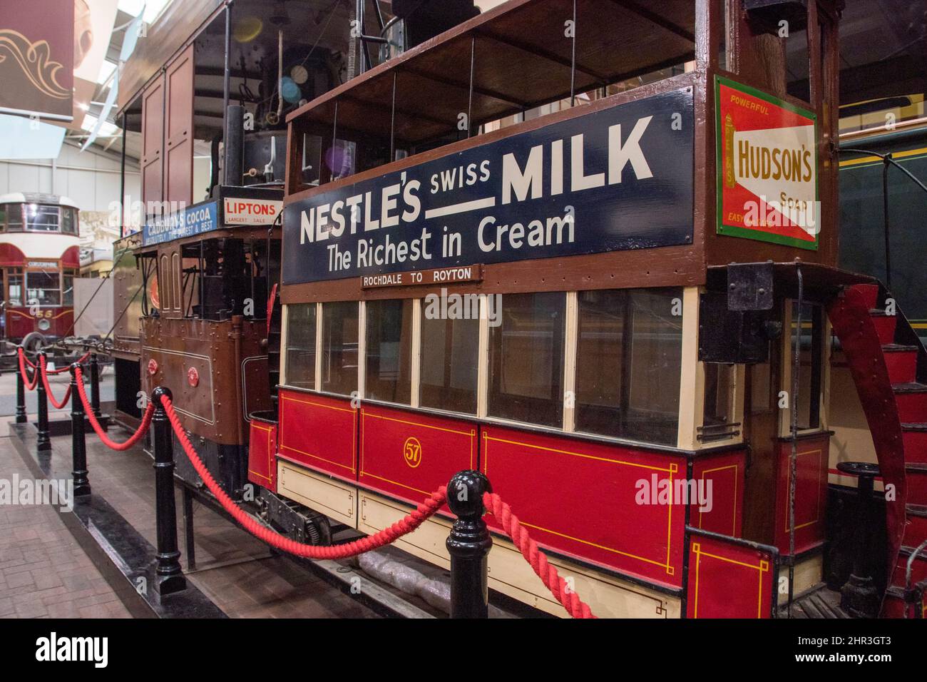 Derbyshire, UK – 5 April 2018: A vintage tiny tram with original Nestle advertising at Crich Tramway Village, the national tram museum Stock Photo