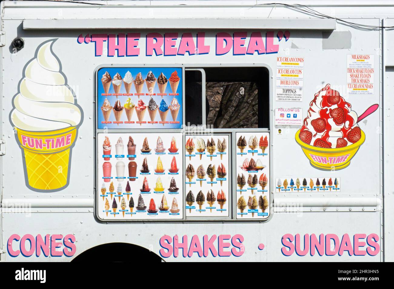 A close up of the side of The Real Deal soft ice cream truck stopped in Flushing meadows Corona Park on a mild late winter day. In Queens, New York. Stock Photo