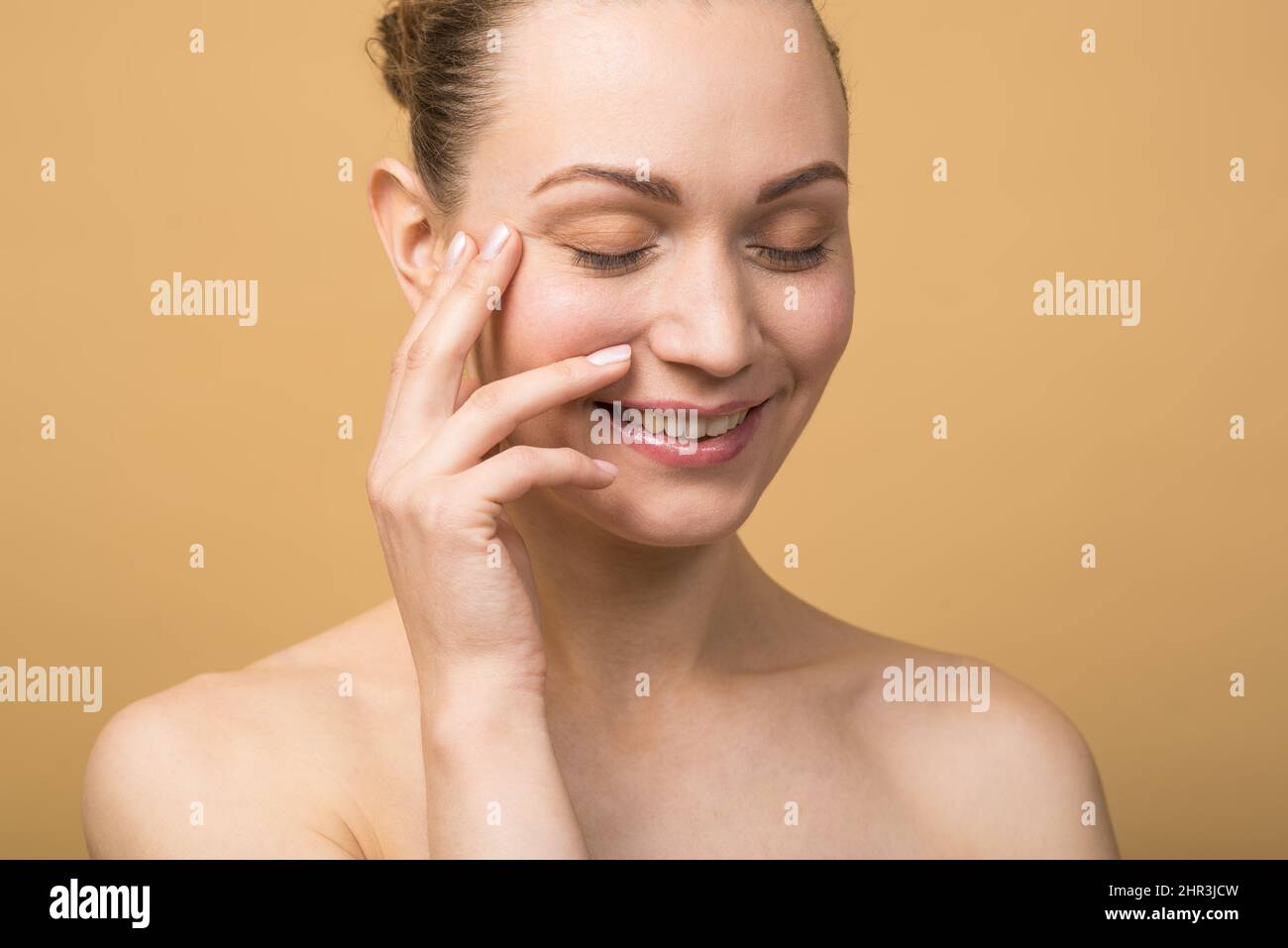 Happy caucasian girl with beautiful face and closed eyes touching ...