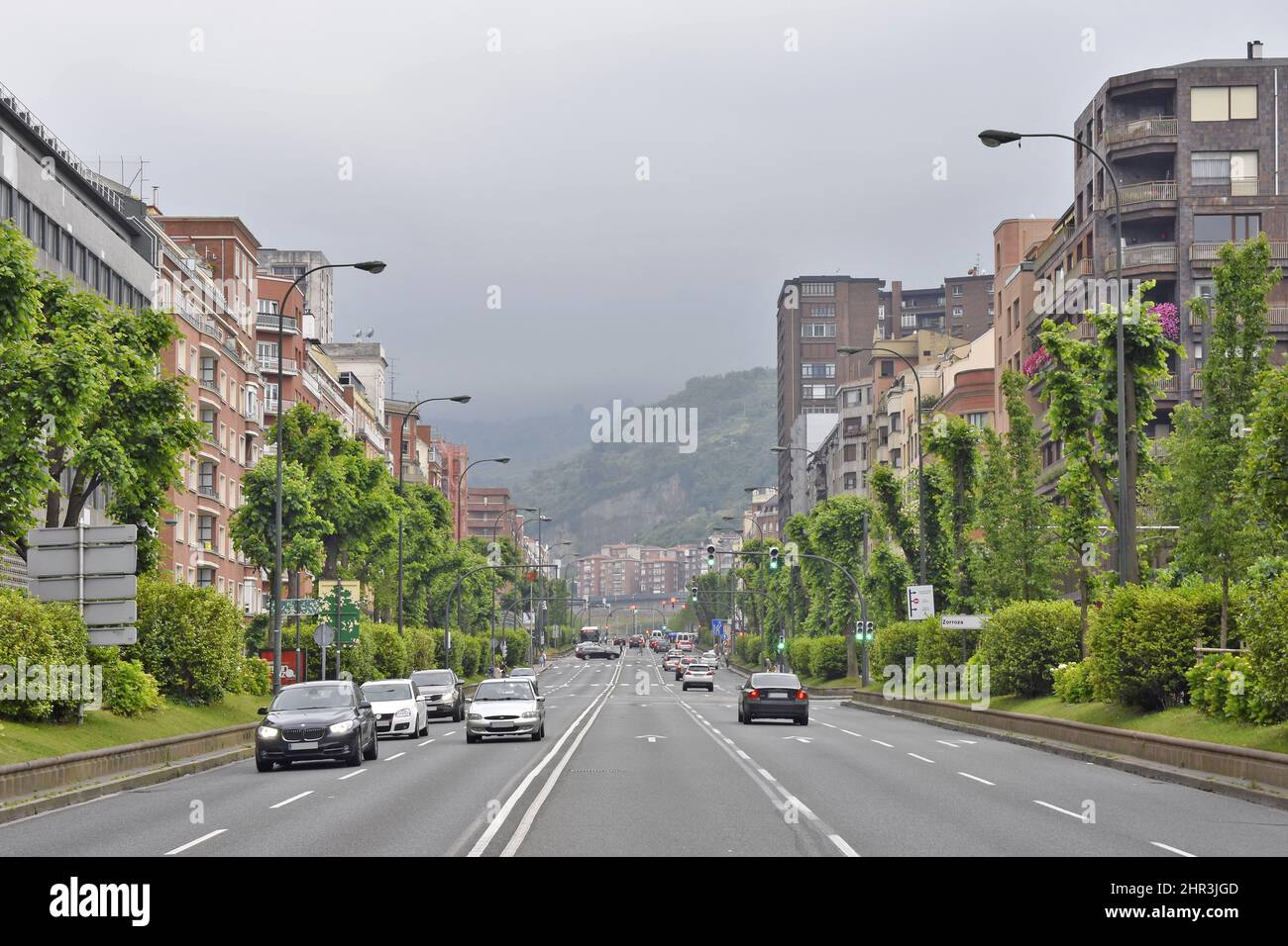 Cars on driveway and residential properties in Bilbao Basque Country Spain. Stock Photo