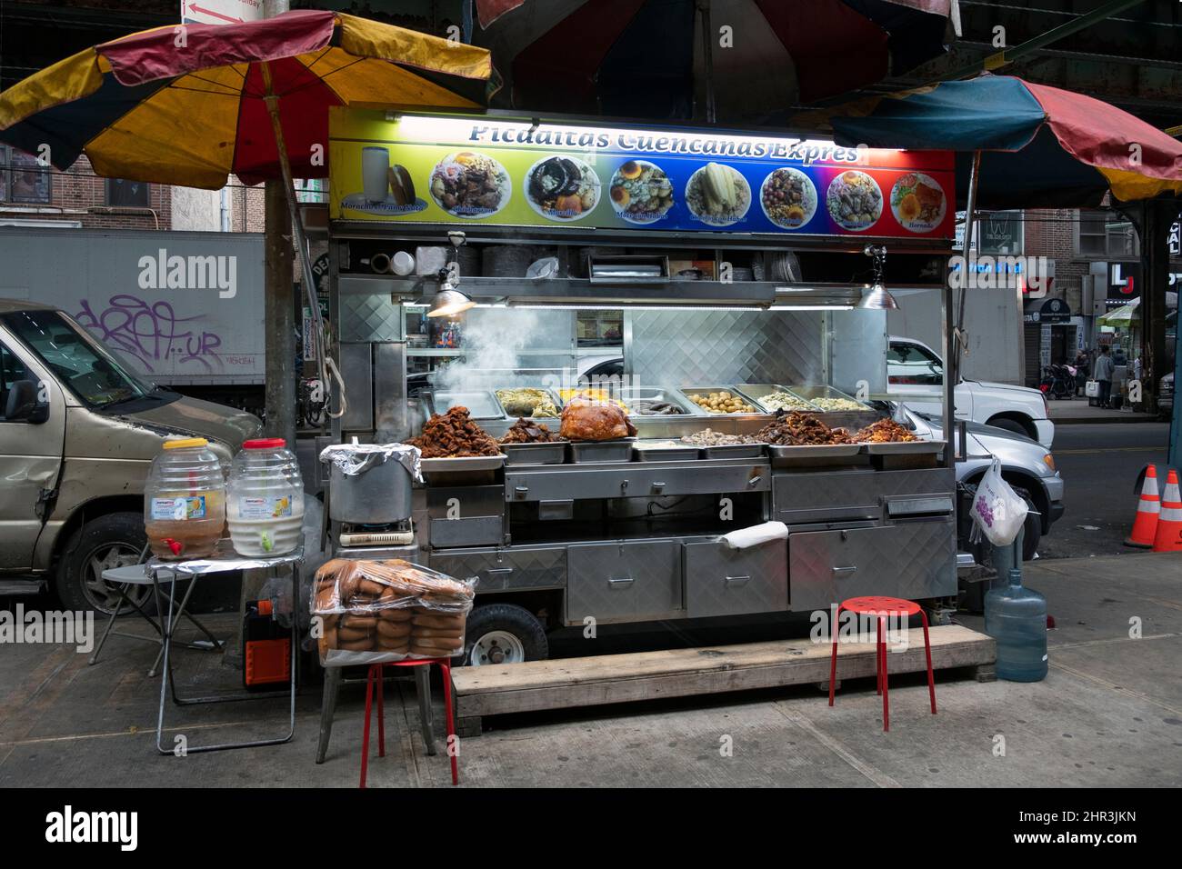 URBAN LANDSCAPE. A food stand selling Mexican Picaditas and other fast foods. Under the el train on Roosevelt avenue in Corona, Queens, New York. Stock Photo