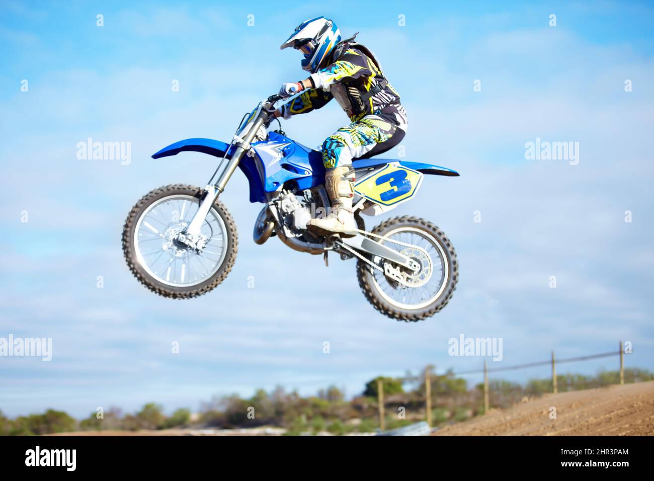 Hes a crowd pleaser. A motocross rider in the air during a jump. Stock Photo