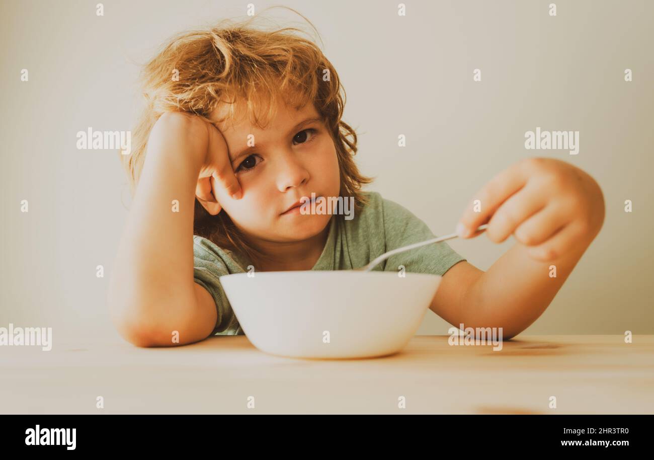 Boy does not want to eat a pasta with cutlet. Little boy does not want ...