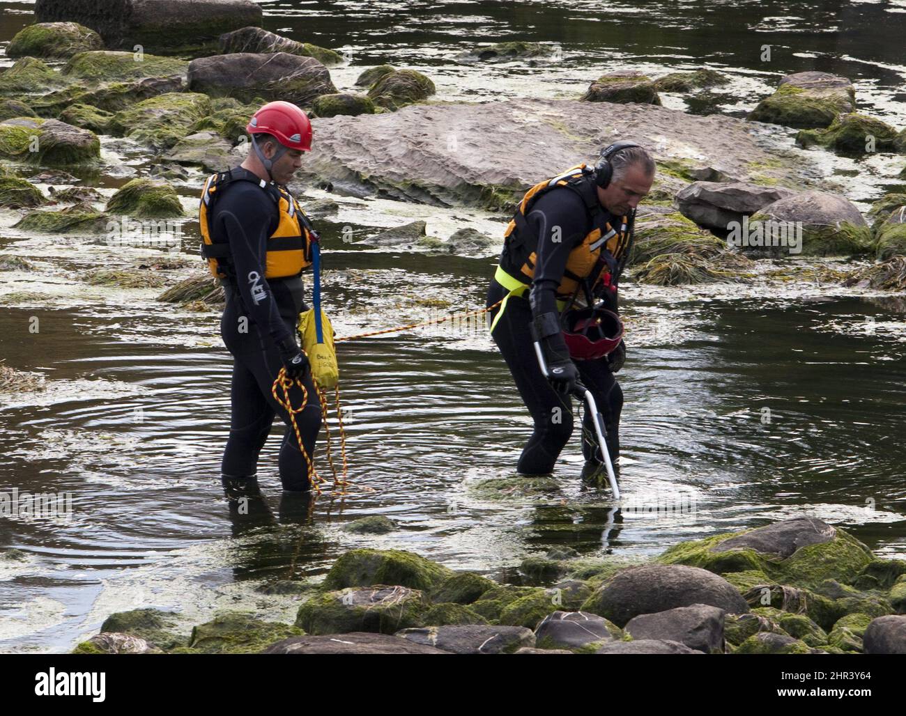 Police divers are scouring the MileIles River near Terrebonne, Que
