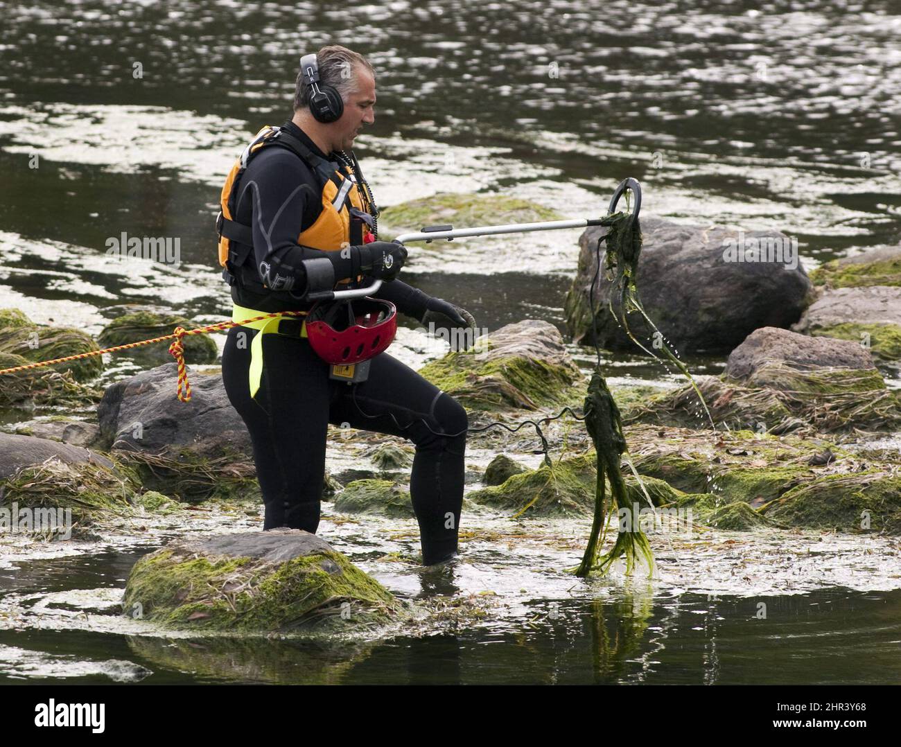 Police divers are scouring the MileIles River near Terrebonne, Que