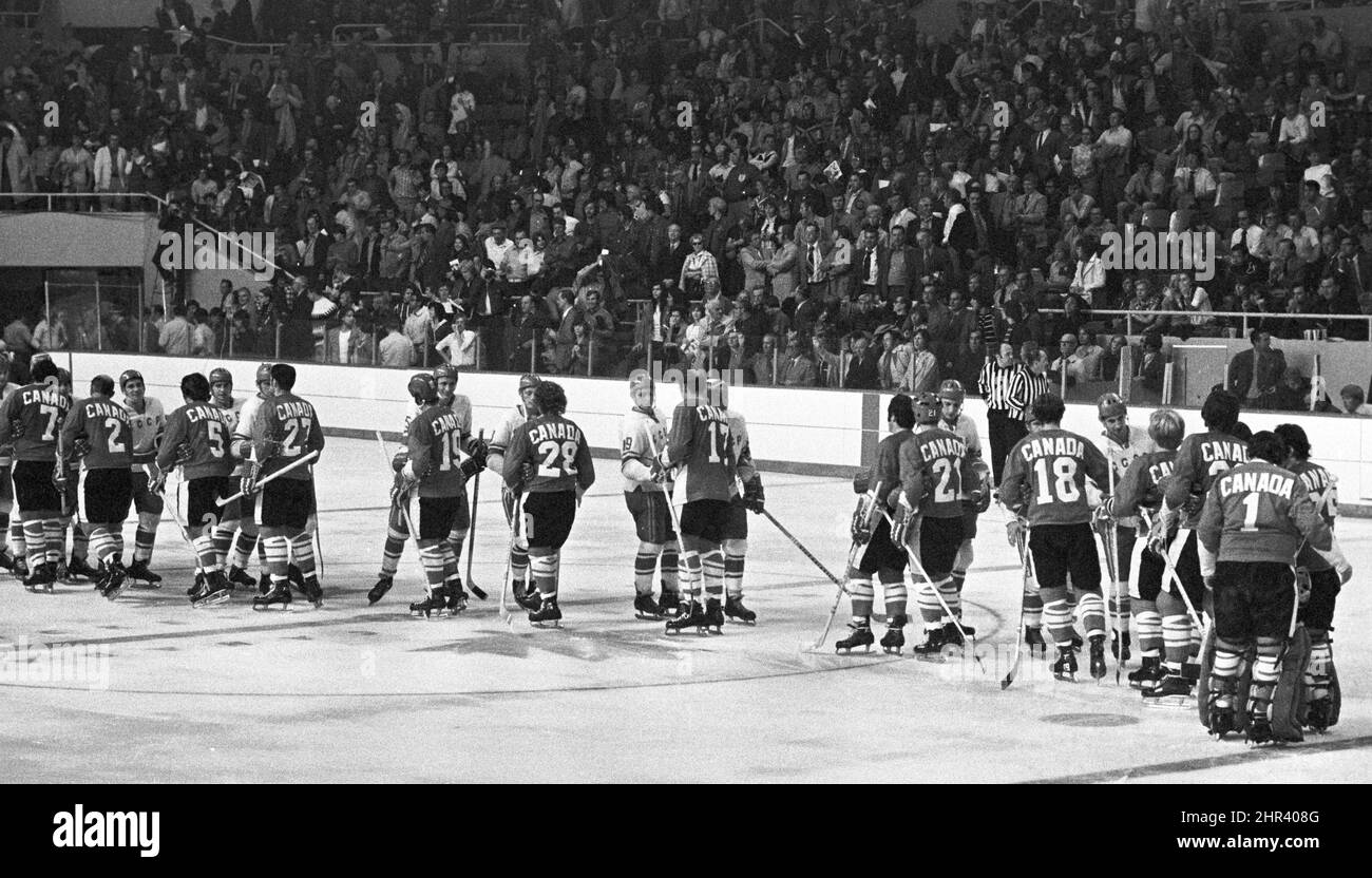 Team Canada and Team USSR players line up to shake hands during the