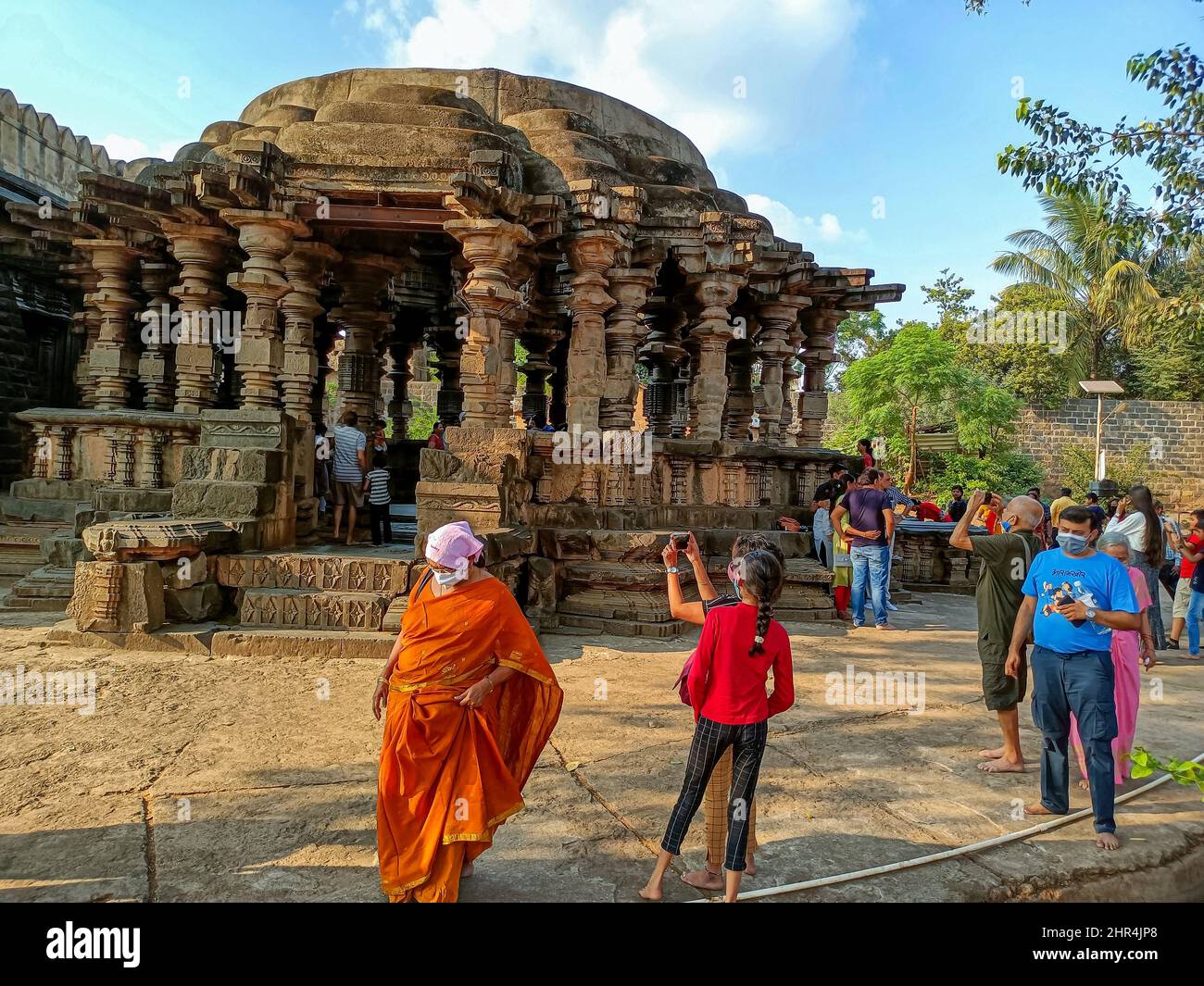 Tourists near an ancient Gopeshwar Mahadev temple Stock Photo