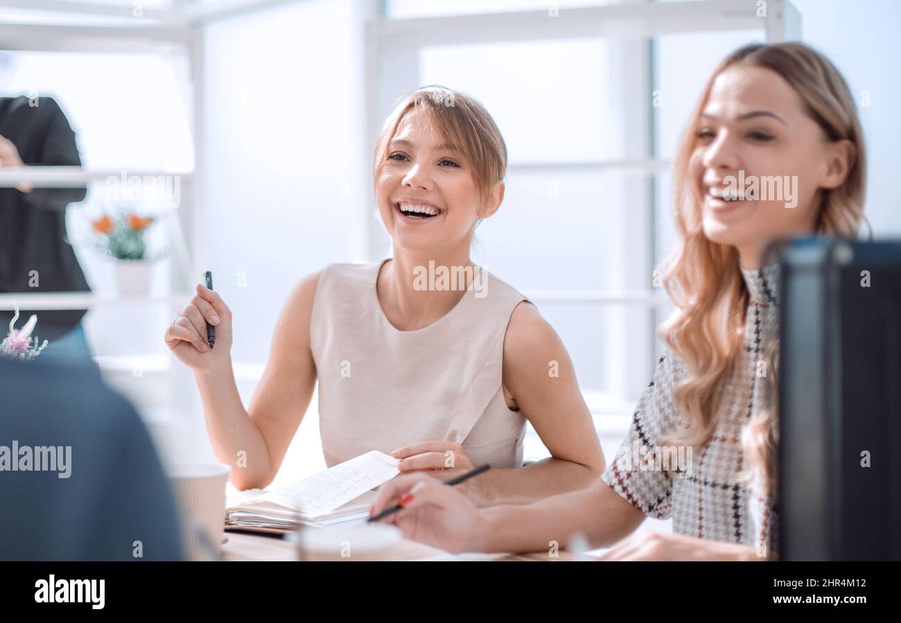 young business woman sitting at office Desk Stock Photo - Alamy