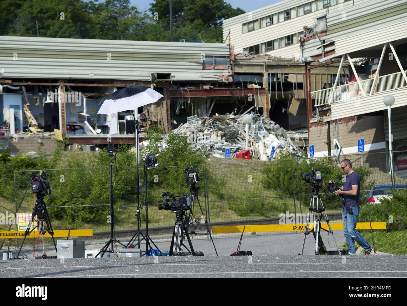 National media camera crews remain set up a day after the recovery of