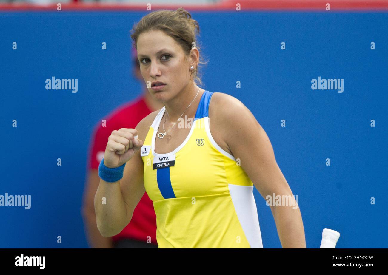 Canada's Stephanie Dubois celebrates a point during her match against  Chanelle Scheepers from South Africa during first round of play at the  Rogers Cup tennis tournament Tuesday, August 7, 2012 in Montreal. (