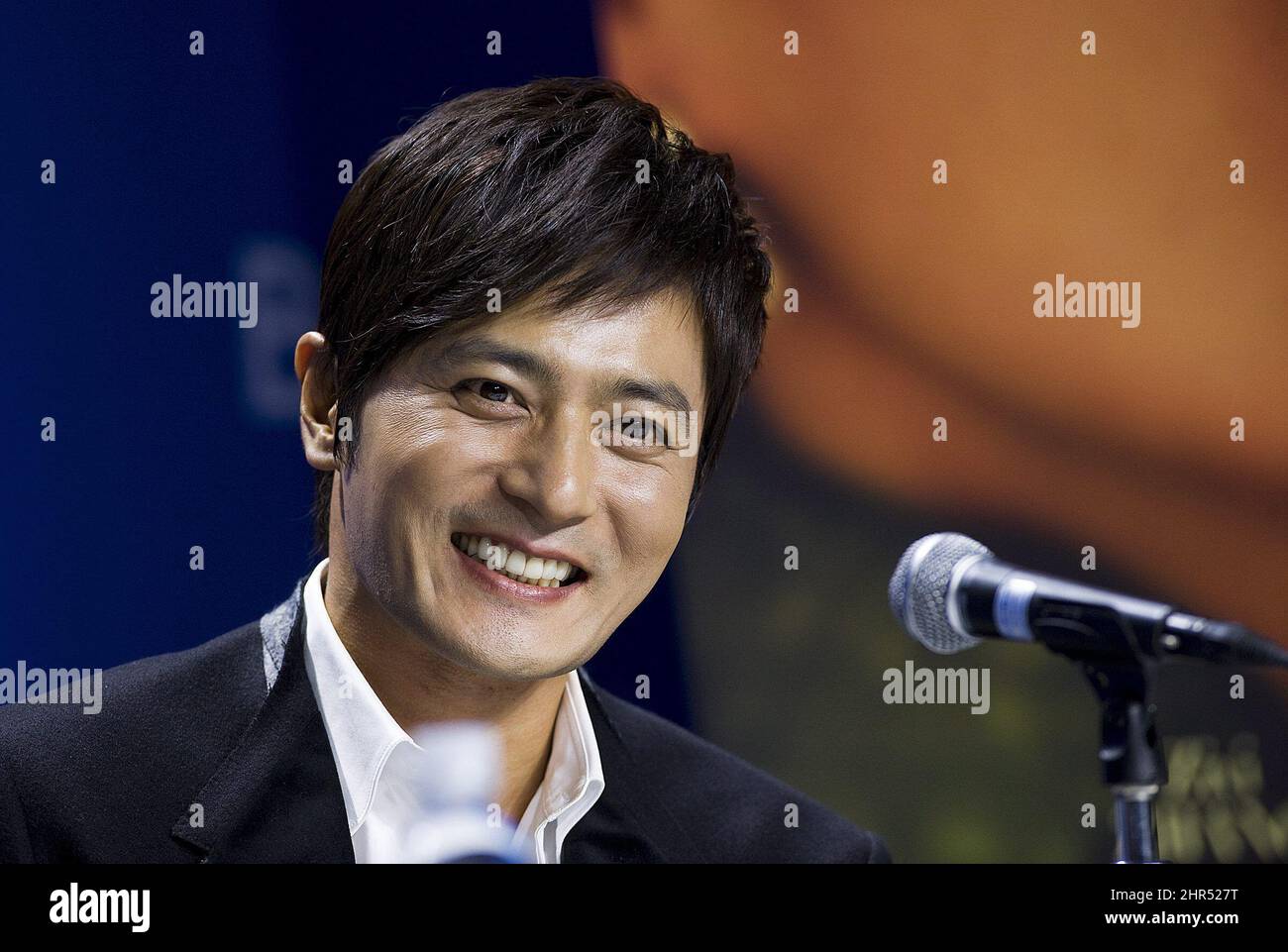 Korean actor Jang Dong-gun smiles during the press conference for the film "Dangerous Liaisons" during the 2012 Toronto International Film Festival in Toronto on Monday, Sept. 10, 2012. (AP Photo/The Canadian Press, Aaron Vincent Elkaim) Stock Photo