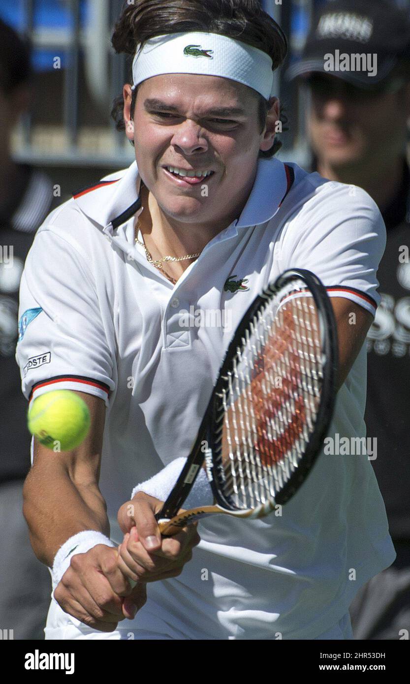 Canada's Milos Raonic hits a shot against South Africa's Izak van der Merwe  in Davis Cup action at Stade Uniprix tennis stadium at Jarry Park in  Montreal, Sunday, Sept. 16, 2012. (AP