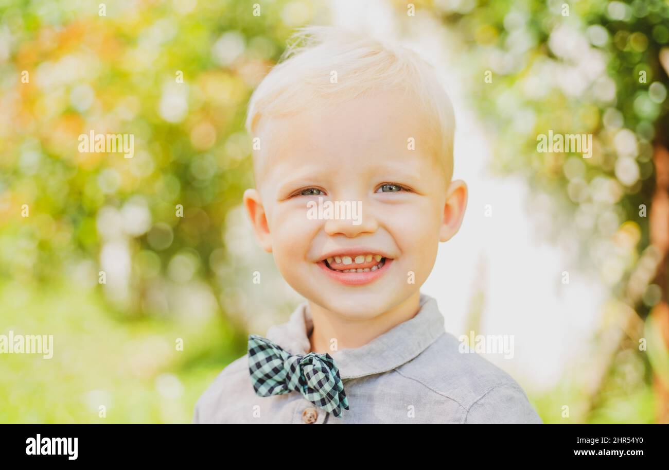 Sunny portrait of little boy. Spring smiling child. Happy childhood ...