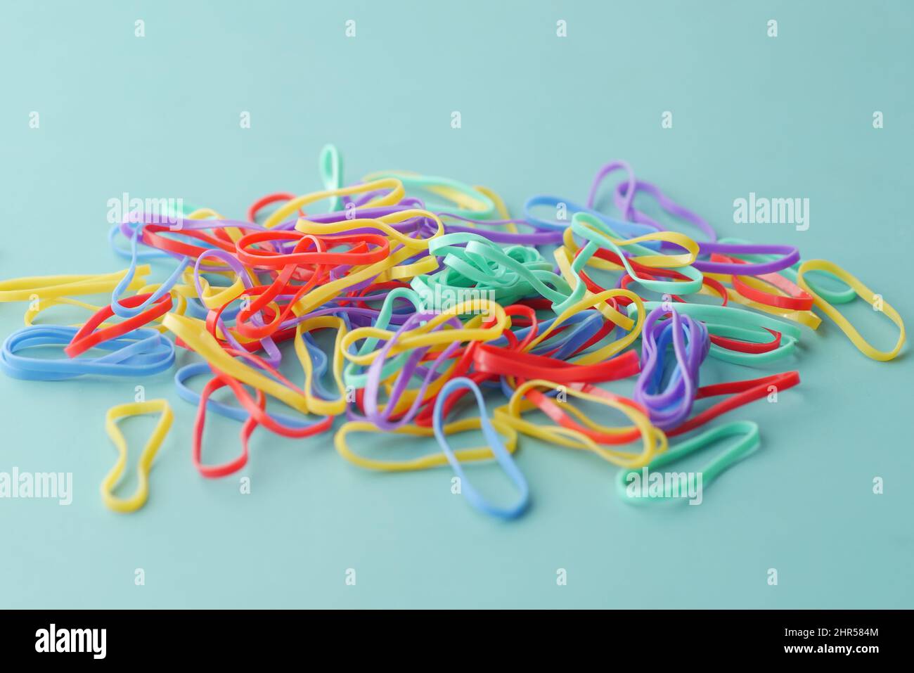 rainbow color Rubber bands on color background  Stock Photo
