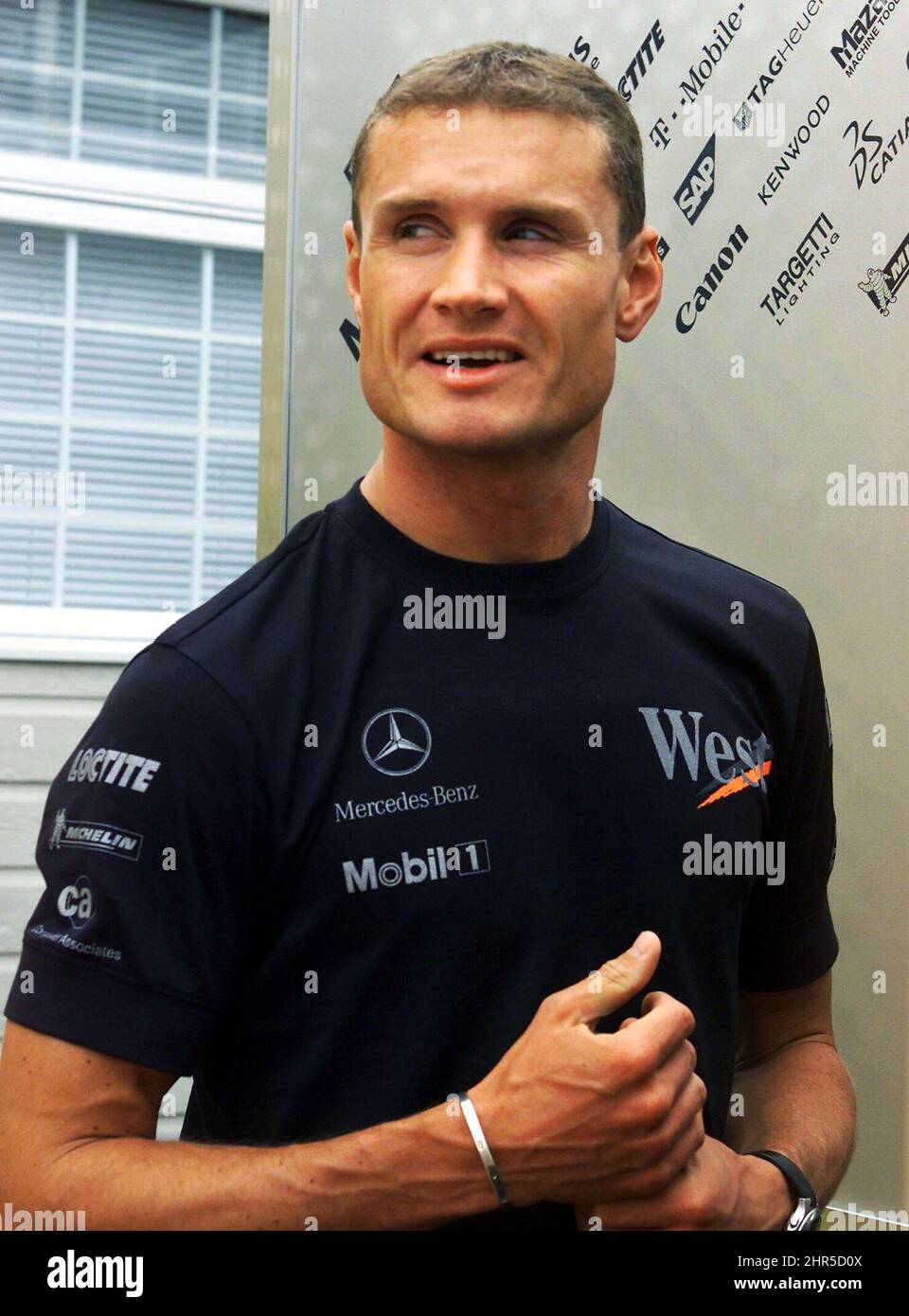 PA PHOTOS/ CP - UK USE ONLY: Britain's David Coulthard chats with staff in the paddocks at the Gilles Villeneuve Circuit in Montreal, Thursday, June 6, 2002. Coulthard will race in the Canadian Grand Prix Sunday.  Stock Photo