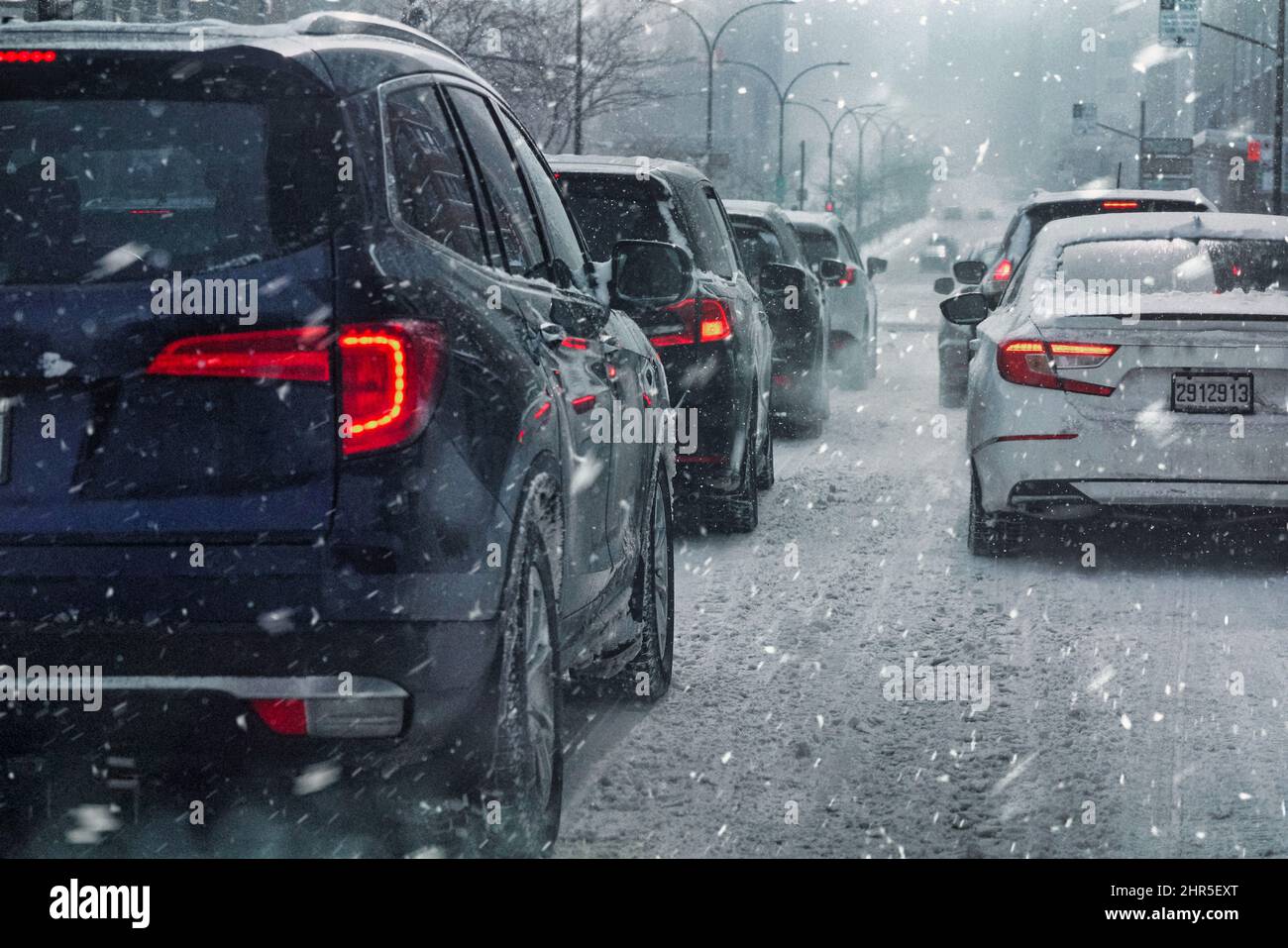 Car and traffic in a snowstorm. Stock Photo