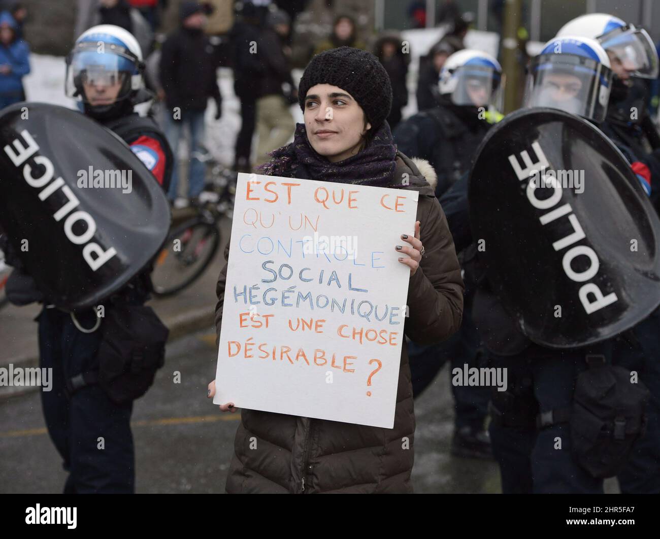 People participate in an anti-police brutality demonstration in Montreal on Friday March 15, 2013. Police used horses, pepper-spray and kettling tactics to clamp down Friday on an annual protest that has a history of getting rowdy.THE CANADIAN PRESS/Ryan Remiorz Stock Photo