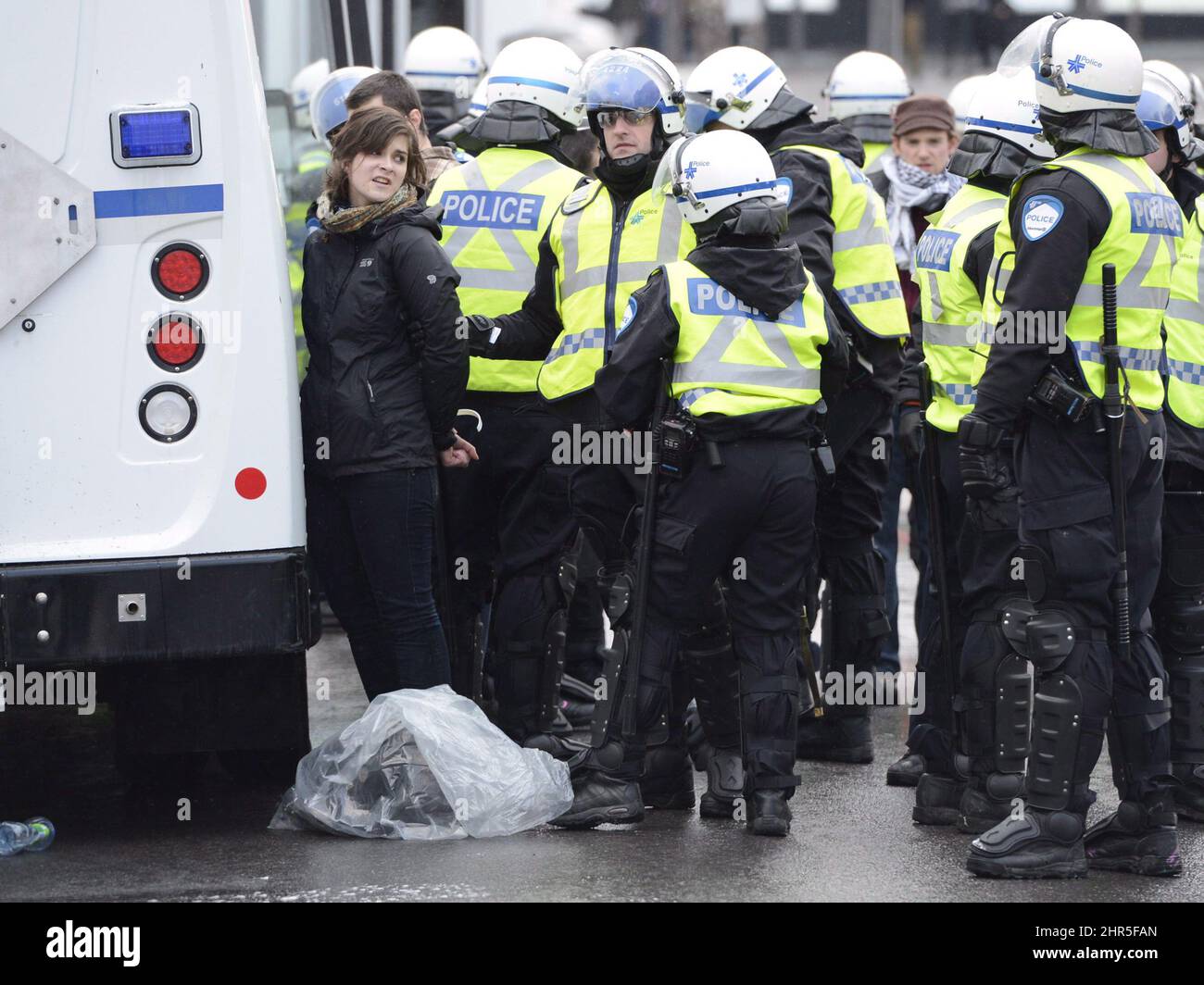 A protestor is arrested during an anti-police brutality demonstration in Montreal on Friday March 15, 2013. Police used horses, pepper-spray and kettling tactics to clamp down Friday on an annual protest that has a history of getting rowdy.THE CANADIAN PRESS/Ryan Remiorz Stock Photo