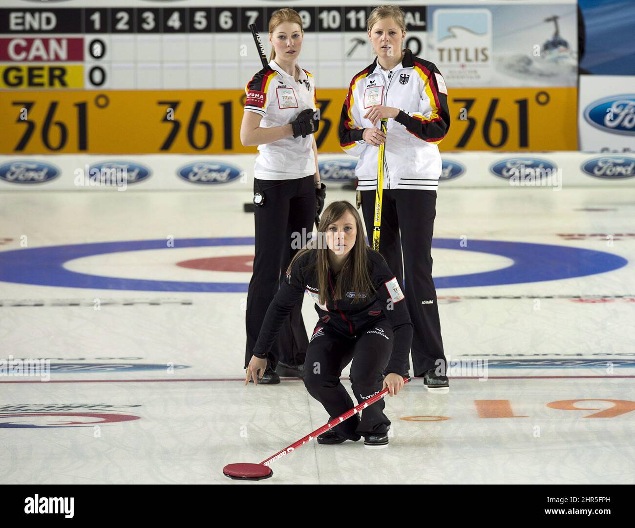 Canada's skip Rachel Homan watches her rock as Germany's Stella Heiss, left, and Corinna Scholz look on at the world women's curling championship in Riga, Latvia on Wednesday, March 20, 2013. THE CANADIAN PRESS/Andrew Vaughan Stock Photo