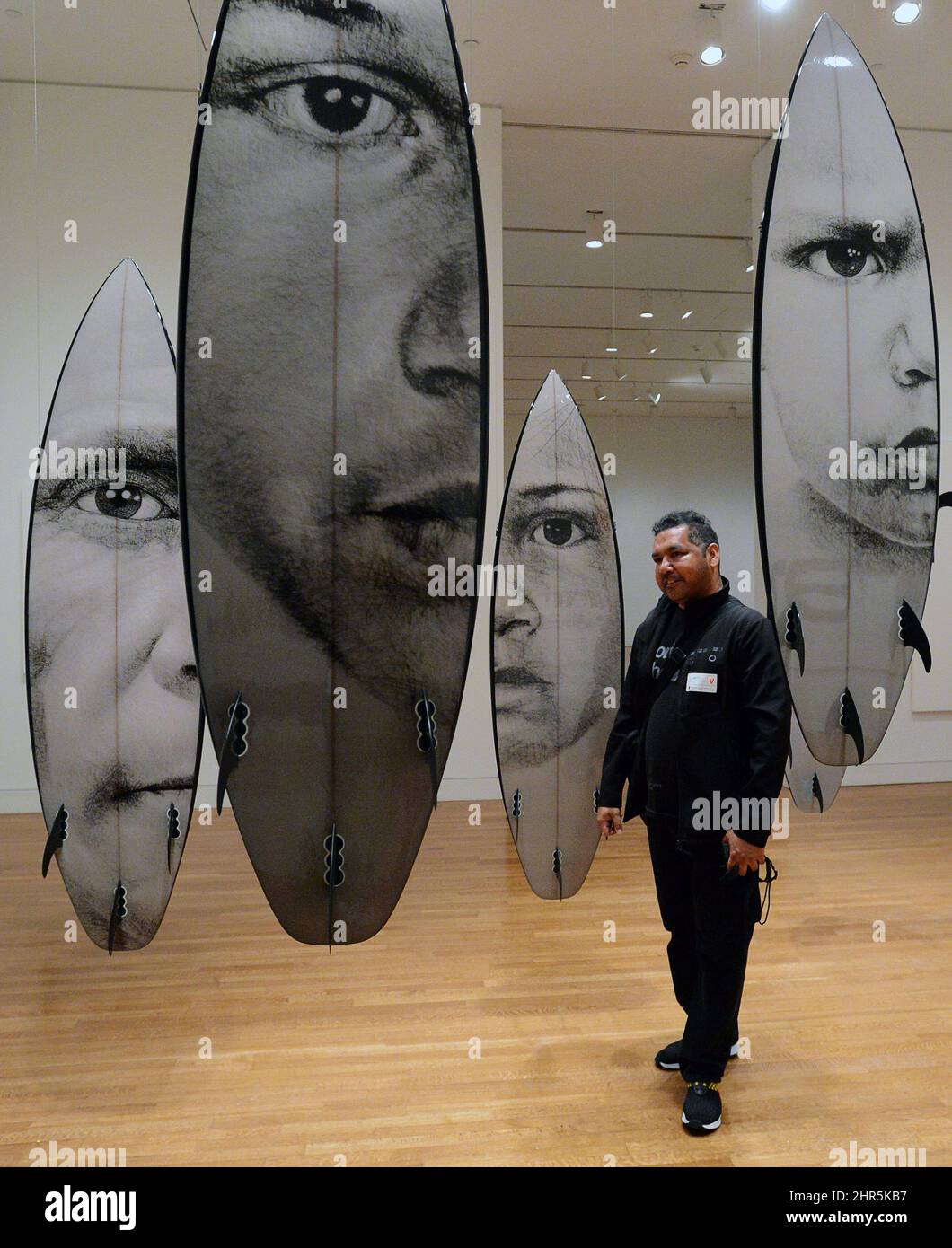 Artist Vernon Ah Kee's looks at his work cantchant during a media ...