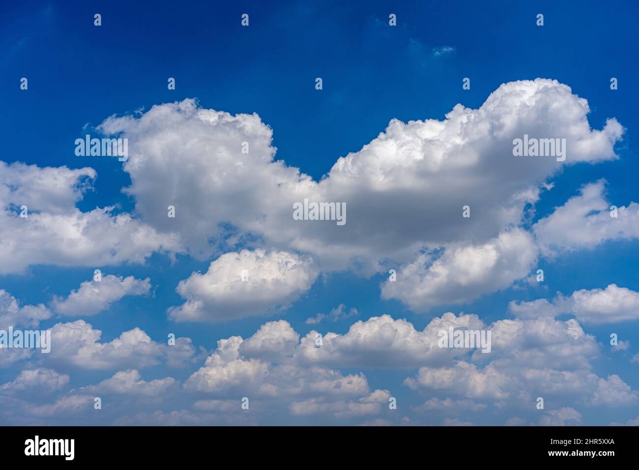 Beautiful blue sky with white cumulus clouds floating Stock Photo - Alamy