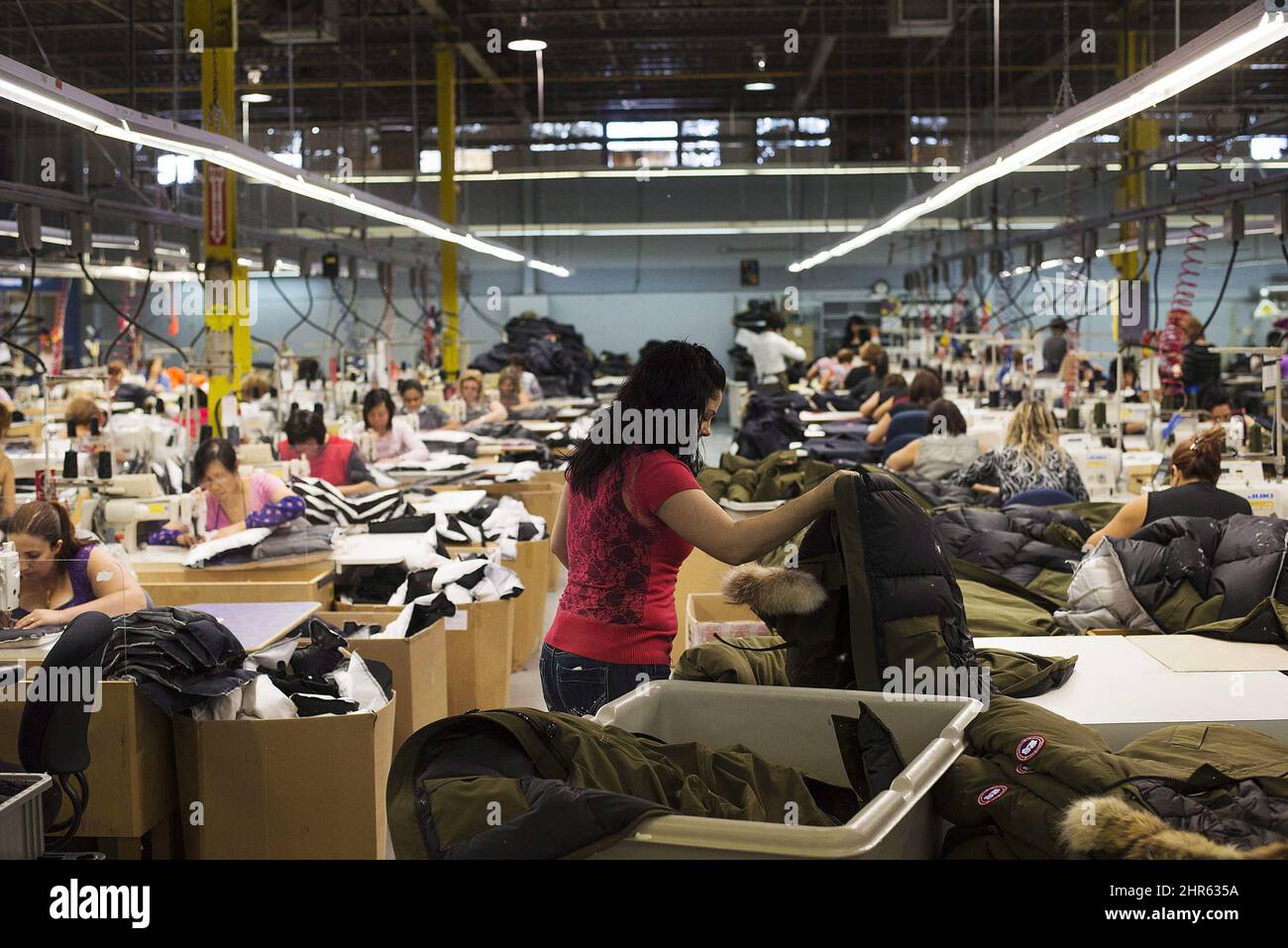 Workers make jackets at the factory of Canada Goose Inc. in Toronto on  Thursday, November 28, 2013. The head of Canada Goose is setting his sights  on India and other parts of