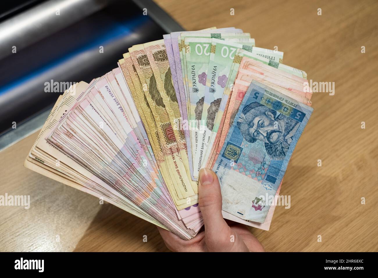 Ukrainian money Ukraine hryvnia paper notes (UAH). Large pile of Ukraine grivna cash. Ukraine’s banking system and economy crisis concept. Stock Photo