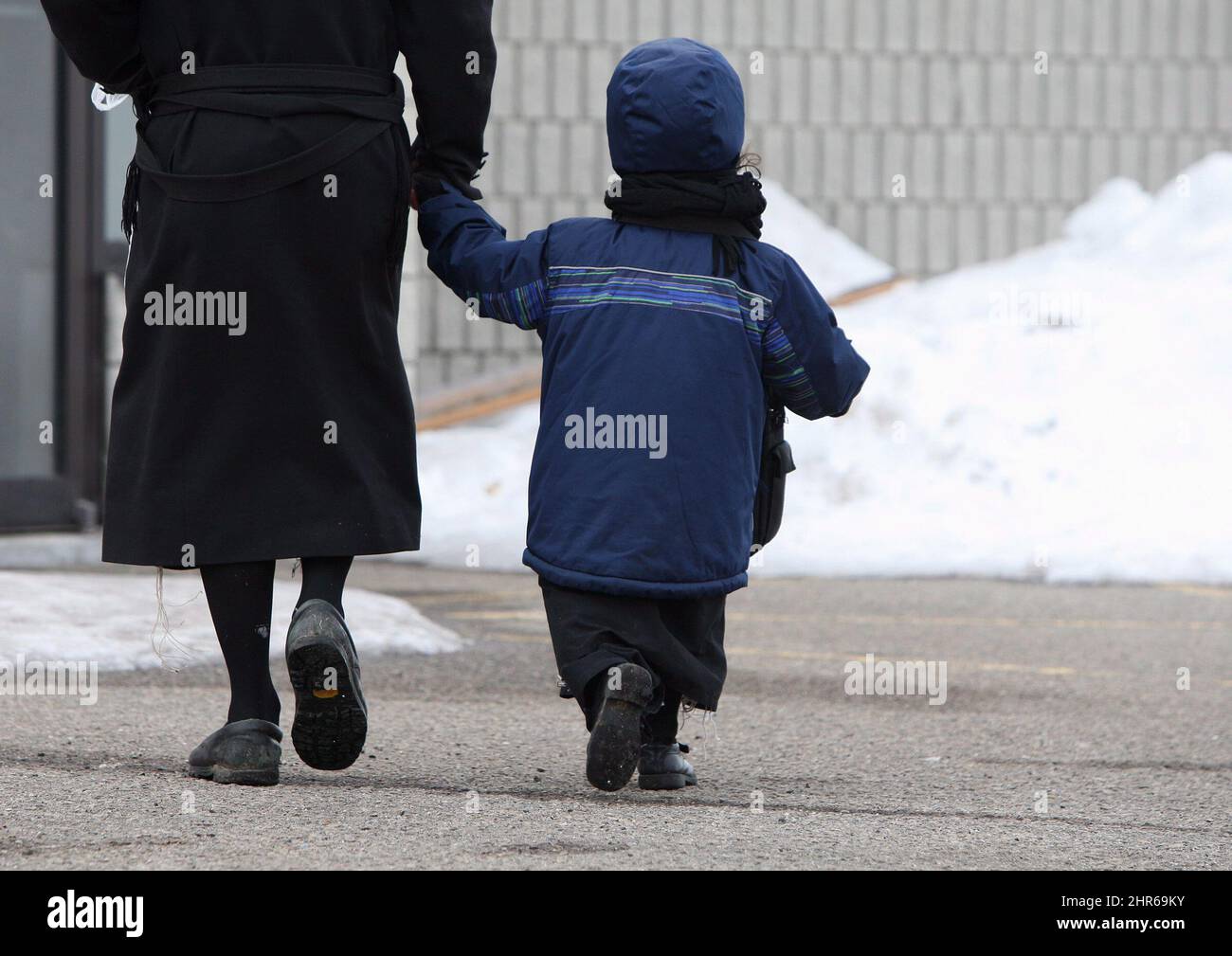 A Child Of The Lev Tahor Ultra orthodox Jewish Sect Is Walked To School A child of the lev tahor ultra orthodox jewish sect is walked to school