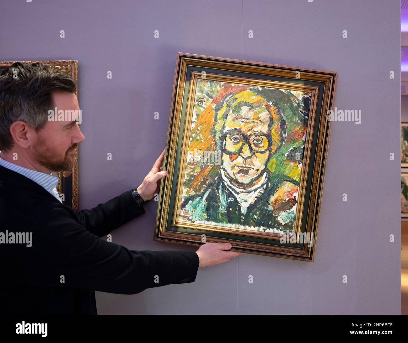 Bonhams, London, UK. 25 February 2022. Sir Michael Caine: The Personal Collection preview before sale on 2 March 2022. He and his wife, Lady Caine, are downsizing and have put some of their treasured possessions up for auction. Image: John Bratby R.A. (British 1928-1992). Portrait of Sir Michael Caine, estimate: £2,000-3,000. Credit: Malcolm Park/Alamy Live News Stock Photo