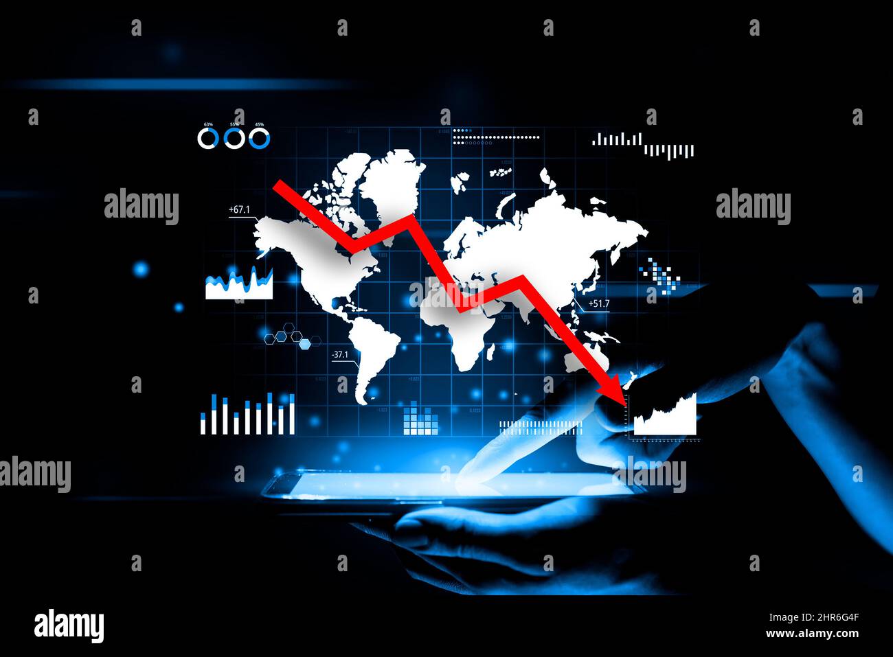 Concept of world crisis. A falling down arrow against the background of a holographic image with a world map Stock Photo