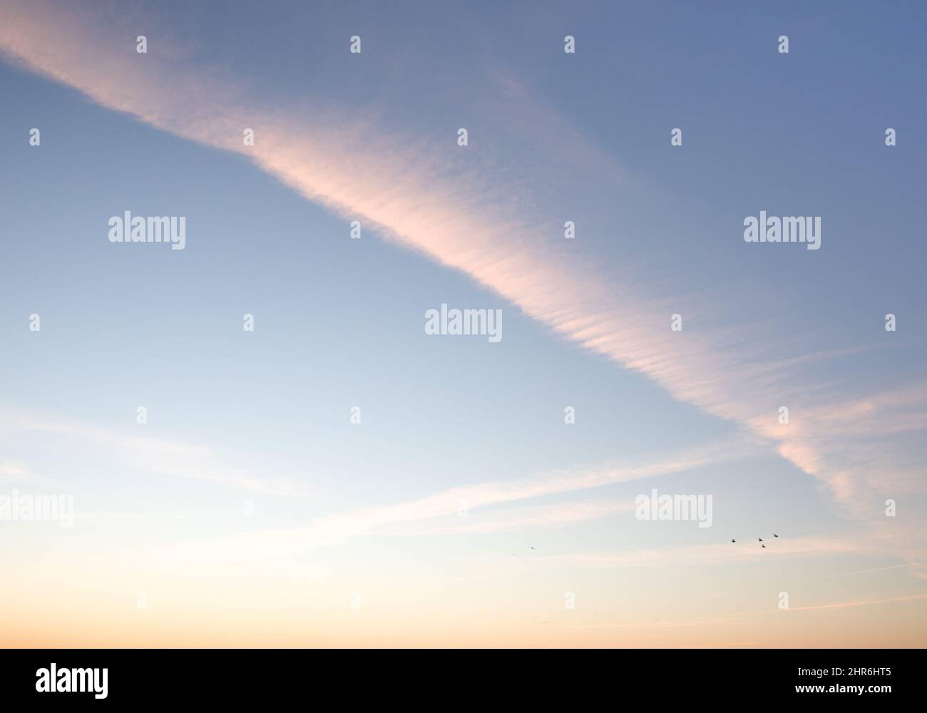 Traces of planes in the sky, exhaust fumes in nice lines on a blue